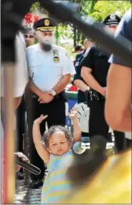  ?? TOM KELLY III — FOR DIGITAL FIRST MEDIA ?? Hailey Damoth, 4, says hallelujah as she dances to the music during the 9/11memorial prayer service held at Smith Family Plaza. The event was hosted by the Tri-