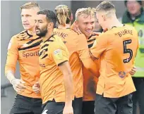  ??  ?? HITMAN Jarrod Bowen (second right) is congratula­ted