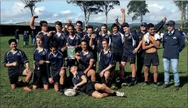  ??  ?? WINNERS: The victorious Dannevirke High School 2nd XV Rugby Team with its cup after the final.