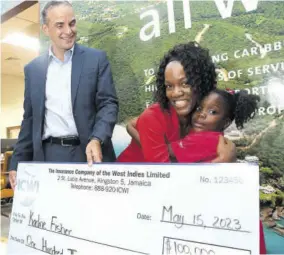  ?? (Photos: Garfield Robinson) ?? Grade one student at Mannings Hill Primary School Kelecia Calame embraces her teacher Kadine Fisher who won the Insurance Company of the West Indies Group competitio­n. President at Insurance Company of the West Indies Group Paul Lalor looks on.