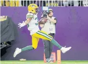  ?? AFP ?? Packers running back Aaron Jones scores a touchdown against the Vikings.