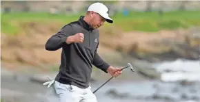  ?? AP ?? Daniel Berger reacts after making an eagle putt on the 18th green of the Pebble Beach Golf Links during the final round of the AT&T Pebble Beach Pro-Am.