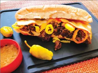  ?? Associated Press photo ?? This Oct. 16 photo shows a pickled pepper pullapart beef hoagie in Amagansett. N.Y. this dish is from a recipe by Elizabeth Karmel.