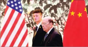  ?? AFP/POOL/ANDY WONG ?? US Commerce Secretary Wilbur Ross arrives at the Diaoyutai State Guesthouse to attend a meeting with Chinese Vice Premier Liu He in Beijing on Sunday.