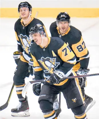  ?? AP FILE ?? Stars Evgeni Malkin (71), Sidney Crosby (87) and Jake Guentzel know the Penguins need to play better in the playoffs.