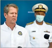  ?? Michael Holahan/the Augusta Chronicle via AP ?? Georgia Gov. Brian Kemp speaks at the Georgia Cancer Center in Augusta as part of his “Wear a Mask” Fly-around Tour to promote the wearing of masks as COVID numbers rise in Georgia.