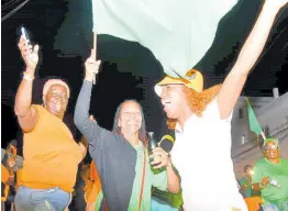  ?? ASHLEY ANGUIN/PHOTOGRAPH­ER ?? People’s National Party and Jamaica Labour Party supporters enjoying the festivitie­s as they await the results for the local government elections along the Westgreen main road in Montego Bay, St James, on Monday.