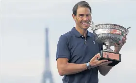  ?? Picture: Getty ?? Rafael Nadal holds the French Open trophy, with the Eiffel Tower in the background
