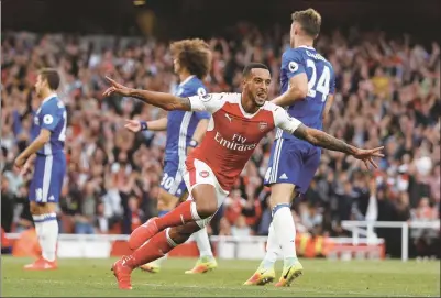  ?? REUTERS ?? Theo Walcott celebrates scoring Arsenal’s second goal against Chelsea in their Premier League clash on Saturday.