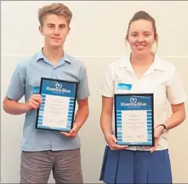  ??  ?? Duncan Hughes and Amy Rodda with their Riverina Blue awards at the Riverina School Sports Associatio­n luncheon.