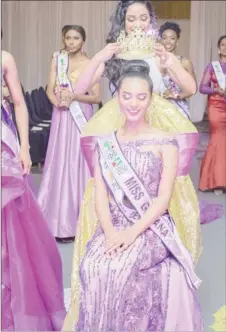  ??  ?? Ambika being crowned by last year’s Miss World Guyana, Vena Mookram