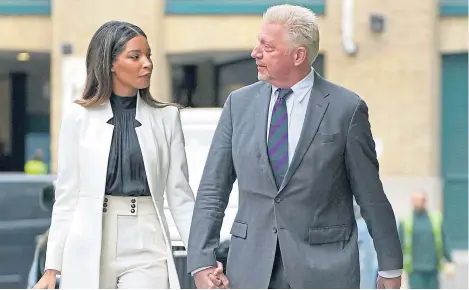  ?? ?? Boris Becker arrives at court in London yesterday with his partner Lilian de Carvalho Monteiro.