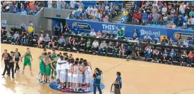  ??  ?? Gilas Pilipinas huddles at center court in front of their ‘home’ crowd at Margaret Court Arena.