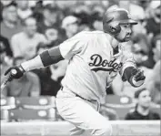 ?? Tannen Maury European Pressphoto Agency ?? ADRIAN GONZALEZ or Yogi Berra? The Dodgers first baseman had fans thinking about his quote.