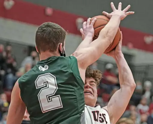  ?? Peter Diana/Post-Gazette ?? Upper St Clair’s Ethan Dahlem is fouled by Pine-Richland’s Andrew Alexander in the WPIAL Class 6A boys championsh­ip game Friday.
