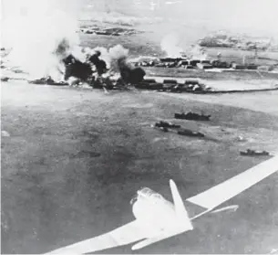  ?? GETTY ?? Japanese photos document early moments of attack at Pearl Harbor on Dec. 7, 1941. In main photo, battleship West Virginia has just been hit by torpedo and Japanese plane can be seen at far r. Above, a Japanese bomber and at l., another Japanese bomber...