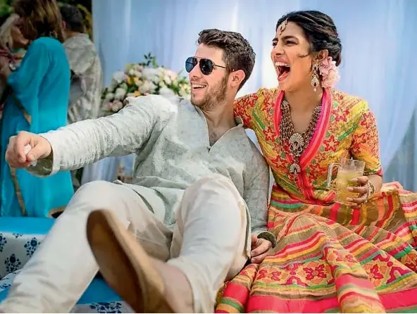  ??  ?? Nick Jonas and Priyanka Chopra having fun at their mehendi ceremony, ahead of their Hindu wedding at Umaid Bhawan in Jodhpur, Rajasthan