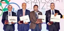  ??  ?? The Bank of Ceylon General Manager D.P.K. Gunasekera (middle) with the award received for Bank of Ceylon as “one of the Top Ten Best Corporate Citizens” in Sri Lanka. From left: AGM Human Resource K.A.D. Wijayaward­ena, DGM Human Resource K.E.D. Sumanasiri and DGM Finance and Planning M.P. Ruwan Kumara are also in the picture with three category awards received for the bank.