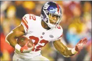  ?? Nick Wass / Associated Press ?? Giants running back Wayne Gallman carries the ball during the second half against the Redskins on Nov. 23.