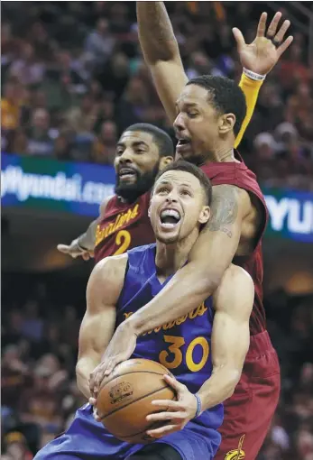  ?? TONY DEJAK / AP ?? Stephen Curry of the Golden State Warriors is fouled by Cleveland Cavaliers’ Channing Frye as Kyrie Irving defends during the second half of their Christmas Day clash in Cleveland. The Cavaliers won 109-108.