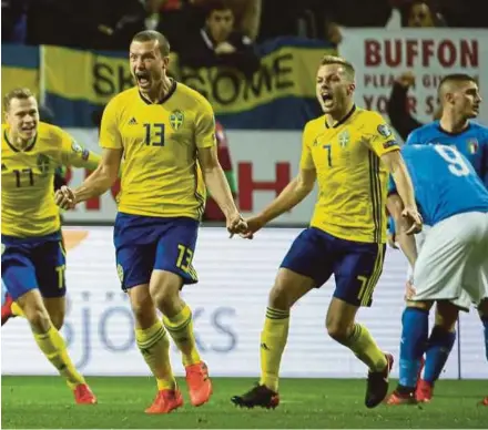  ?? AFP PIC ?? Sweden’s Jakob Johansson (second from left) celebrates his goal with teammates in a World Cup 2018 qualificat­ion match against Italy in Solna, Sweden, on Friday.