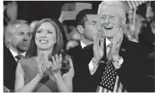  ?? | CAROLYN KASTER/AP ?? Chelsea Clinton and former President Bill Clinton applaud as Hillary Clinton speaks during the final day of the Democratic National Convention.