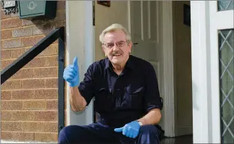  ??  ?? Shay Martin sitting on the doorstep of his house at Seacrest, Bray, where he has been cocooned for more than two weeks now.