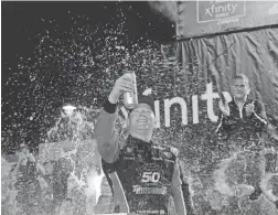 ?? TERRY RENNA/AP ?? Tyler Reddick celebrates Saturday after winning the NASCAR Xfinity Series championsh­ip at Homestead-Miami Speedway.