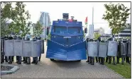  ?? (TUT.by/AP) ?? Riot police in Minsk, Belarus, form alongside a water cannon to block opposition supporters Sunday during a rally protesting the country’s presidenti­al election results. More than 100,000 demonstrat­ors calling for the resignatio­n of President Alexander Lukashenko marched Sunday as daily protests entered their sixth week.