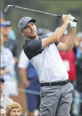  ??  ?? Russell Henley, a former University of Georgia golfer, tees off on the 12th hole at Wednesday’s Masters practice round in Augusta. He won the Shell Houston Open on Sunday, earning a Masters invite.