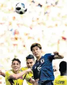  ??  ?? Crucial moment: Japan’s Yuya Osako escapes his marker to head the winner