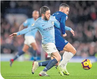  ??  ?? City’s Bernardo Silva and Chelsea’s Eden Hazard fight for the ball