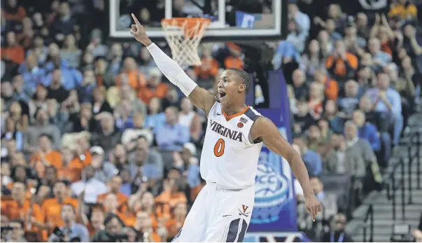  ??  ?? Virginia’s Devon Hall and the Cavaliers are the No. 1 seed in the South Region. BRAD PENNER/USA TODAY SPORTS