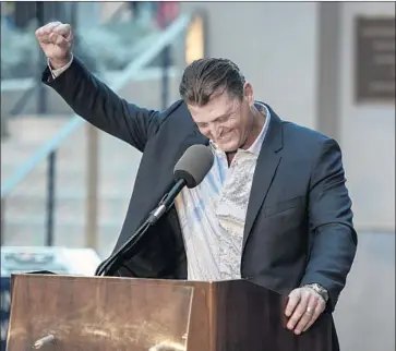  ?? Kyusung Gong Associated Press ?? TREVOR HOFFMAN reacts to a comment during a news conference in San Diego after being elected to the baseball Hall of Fame. “I couldn’t imagine being in a different role,” the former Padres closer says.
