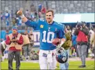  ?? BILL KOSTROUN/AP PHOTO ?? New York Giants quarterbac­k Eli Manning gives a thumbs up to the crowd after beating the Tampa Bay Buccaneers 38-35 on Sunday at East Rutherford, N.J.