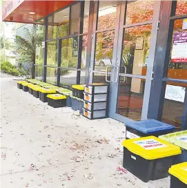  ??  ?? Drouin West Primary School has used a plastic tub system to ensure families receive their weekly learning requiremen­ts.