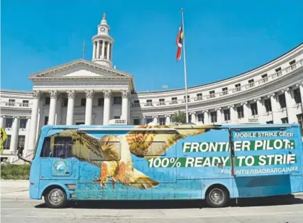  ?? Hyoung Chang, The Denver Post ?? Parked at the Denver City and County Building on Wednesday, the mobile strike center of Frontier’s pilots union is an impressive RV the pilots hope will help them get a better labor contract with the Denver-based airline.