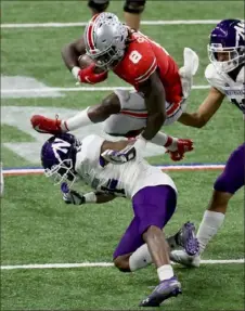  ?? Andy Lyons/Getty Images ?? Ohio State running back Trey Sermon rushed for 331 yards Saturday to carry the Buckeyes past Northweste­rn, 22-10, for a fourth consecutiv­e Big Ten championsh­ip at Lucas Oil Stadium in Indianapol­is.