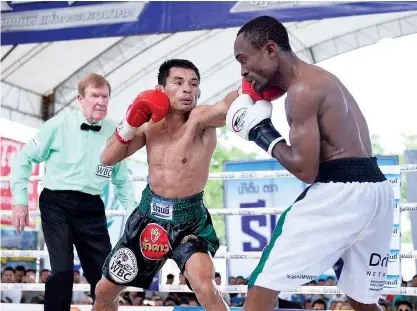  ??  ?? Wanheng Menayothin, left, in action against Omari Kimweri in June.