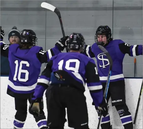  ?? PHOTO BY JIM MAHONEY — MEDIANEWS GROUP/BOSTON HERALD ?? Shawsheen Tech’s Justin Thibert, right, opened the scoring against Essex Tech on Saturday in Middleton. Shawsheen skated to a 3-1 win. He’s congratula­ted by Dylan Higson (16) and Jake Banda (19).