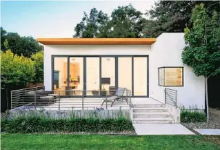  ?? DAVE EDWARDS ?? The pandemic has pushed the demand for accessory dwelling units, or ADUs, like this one in Palo Alto, California, designed by Maydan Architects. They fill an increased need for affordable housing or a separate home office. Fortunatel­y, more city and state regulation­s are allowing them.