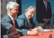  ??  ?? U.S. Soccer President Sunil Gulati, left, watches as Mexico’s Decio de Maria signs the joint bid agreement. CATALINA FRAGOSO, USA TODAY SPORTS