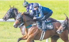  ?? Picture: GETTY ?? EASY DOES IT: Craig Williams (navy blue) rides Personal to victory in a barrier trial at Randwick.