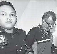  ?? — Gambar Bernama ?? BICARA: S. Muthusamy dihadapkan di Mahkamah Majistret semalam atas tuduhan membunuh seorang pengawal keselamata­n pertengaha­n bulan ini.