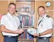  ?? Picture supplied ?? THE Zaandam’s Captain Smit Ane Jan, left, of the Netherland­s, was welcomed by Captain Eric Durr, the Transnet Port Authority Port of Durban harbour master’s office representa­tive,. |