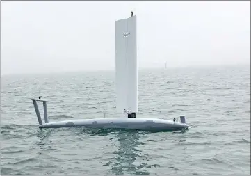  ??  ?? An Ocean Aero Submaran S10 parks itself on the ocean surface, sail extended. — Ocean Aero photo