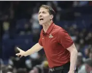  ?? (NWA Democrat-Gazette/Charlie Kaijo) ?? Arkansas men’s basketball Coach Eric Musselman said he wishes the NCAA would adopt rules to make college basketball more uniform with the profession­al ranks, including switching from two 20-minute halves to four quarters and reducing the shot clock from 30 seconds to 24.
