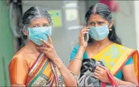  ?? PTI ?? Family members of a patient admitted at the Kozhikode Medical College wear safety masks on Tuesday as a precaution­ary measure after Nipah virus cases were reported in the district.