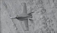  ?? BEN MARGOT, THE ASSOCIATED PRESS ?? A Super Hornet jet fighter flies over Death Valley National Park, Calif. The cost of buying new jets has been a thorny question in Canada.