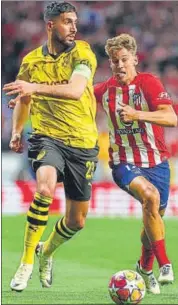  ?? AFP ?? Emre Can (L) is chased by Atletico's Marcos Llorente.